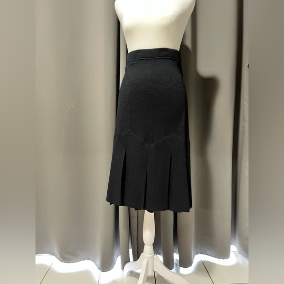 St. John Beautiful flowy dress skirt. Black flared at bottom with slits.